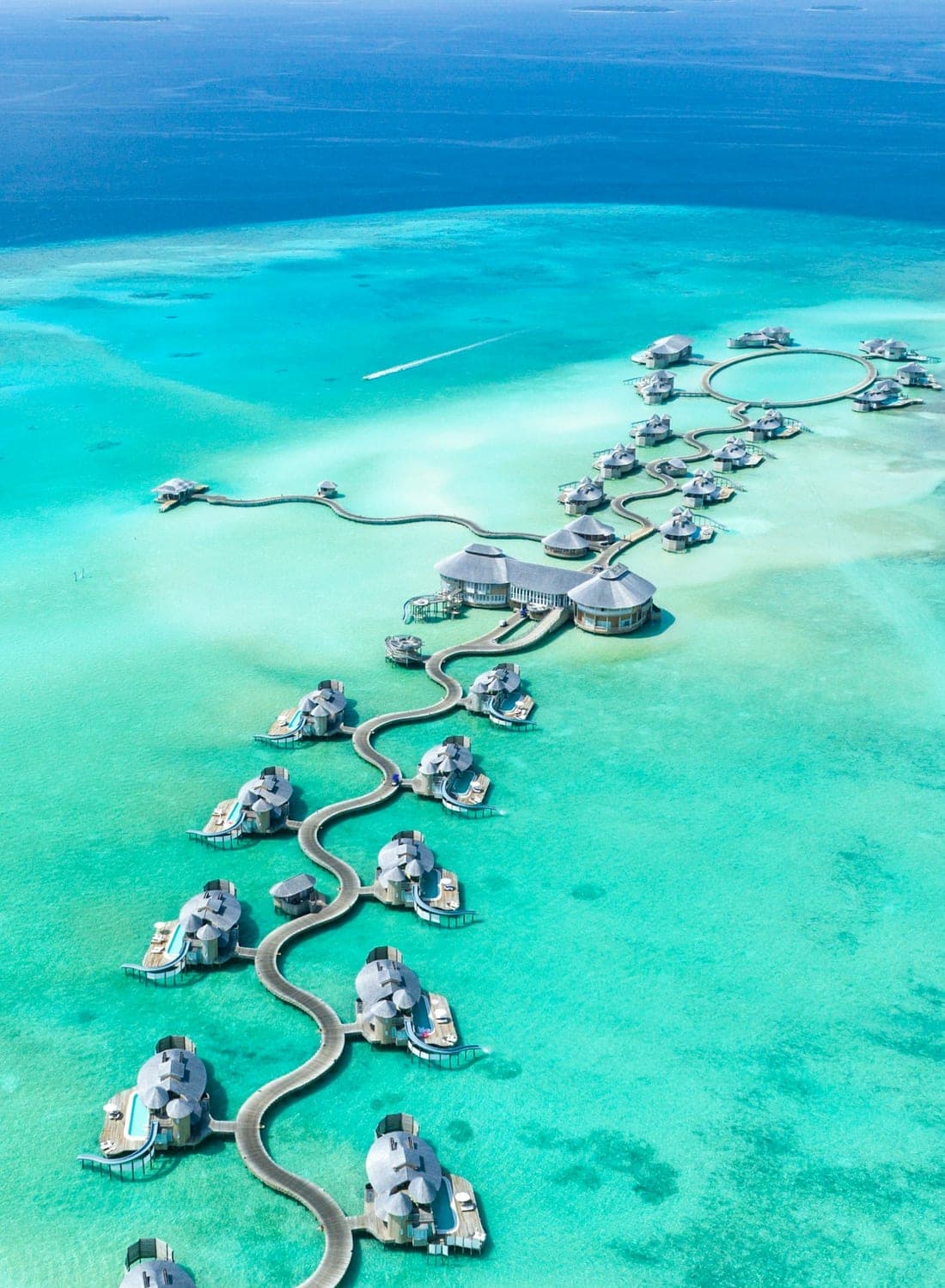 Overwater villas on a turquoise lagoon